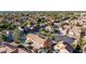 Aerial view featuring homes with terracotta roofs, mature trees, and a well-planned neighborhood layout at 819 W Kyle E Ct, Gilbert, AZ 85233