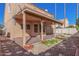 Charming covered patio provides a shady retreat in this home's private backyard with a sparkling pool at 819 W Kyle E Ct, Gilbert, AZ 85233