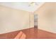 Bedroom with vinyl floors, a ceiling fan and a bright window at 819 W Kyle E Ct, Gilbert, AZ 85233