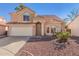 Charming two-story home featuring a tile roof, two car garage and low maintenance desert landscaping at 819 W Kyle E Ct, Gilbert, AZ 85233