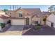 Inviting two-story home with tile roof, attached garage, and landscaped front yard creating curb appeal at 819 W Kyle E Ct, Gilbert, AZ 85233