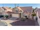 Desirable two-story home featuring a tile roof, a two-car garage, and a neatly maintained landscape at 819 W Kyle E Ct, Gilbert, AZ 85233