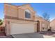 Charming two-story home featuring a tile roof, two car garage and low maintenance desert landscaping at 819 W Kyle E Ct, Gilbert, AZ 85233