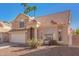 Charming two-story home featuring a tile roof, two car garage and low maintenance desert landscaping at 819 W Kyle E Ct, Gilbert, AZ 85233