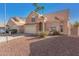 Charming two-story home featuring a tile roof, two car garage and low maintenance desert landscaping at 819 W Kyle E Ct, Gilbert, AZ 85233