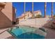 A refreshing swimming pool sits nestled within a walled backyard space, offering a private oasis at 819 W Kyle E Ct, Gilbert, AZ 85233