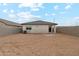 Unfinished backyard with dirt ground, surrounded by block fencing and the home's exterior at 8452 W Clemente Way, Florence, AZ 85132