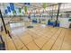 Bright indoor basketball court with hardwood floors, hoops, and glass windows at 8452 W Clemente Way, Florence, AZ 85132