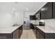 Beautiful kitchen featuring granite countertops, dark cabinetry, and stainless steel appliances for the home chef at 8452 W Clemente Way, Florence, AZ 85132