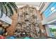 Indoor rock climbing wall with visible handholds and climbing ropes next to the pool at 8452 W Clemente Way, Florence, AZ 85132