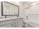 Bathroom features double sink vanity with granite countertop, modern fixtures, and shower-tub combination at 8553 N 175Th Ln, Waddell, AZ 85355