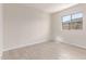 Bright bedroom with tile flooring, window for natural light, and ample space for furnishings at 8553 N 175Th Ln, Waddell, AZ 85355