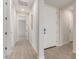 Bright entryway featuring neutral walls, tile floors, and a white front door at 8553 N 175Th Ln, Waddell, AZ 85355