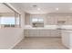 Bright kitchen with white cabinets, granite countertops, and stainless steel appliances at 8553 N 175Th Ln, Waddell, AZ 85355