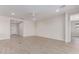 Spacious living room with neutral walls, ceiling fan, and stylish tile floors at 8553 N 175Th Ln, Waddell, AZ 85355