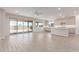 Open living space features tile floors, kitchen access, and patio doors at 8553 N 175Th Ln, Waddell, AZ 85355