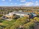 An aerial shot of community center with desert landscape, residential area and mountains in the distance at 8554 W Trenton Ct, Florence, AZ 85132