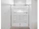 Modern bathroom featuring a spacious shower with glass doors and white tile at 8554 W Trenton Ct, Florence, AZ 85132