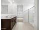 Modern bathroom featuring a double vanity, walk-in shower and ample space creating a comfortable and functional design at 8554 W Trenton Ct, Florence, AZ 85132