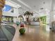 Open-concept community center lobby with high ceilings, large windows, and recreational features at 8554 W Trenton Ct, Florence, AZ 85132