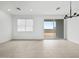 Open dining room with tile floors, recessed lighting, and backyard patio access at 8554 W Trenton Ct, Florence, AZ 85132