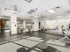 Well-equipped exercise room with stationary bikes, weights, mirrors, and views of the rock wall at 8554 W Trenton Ct, Florence, AZ 85132