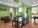 Inviting game room with ping pong table, foosball, pool table, and comfortable seating area at 8554 W Trenton Ct, Florence, AZ 85132