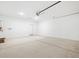 Bright garage with concrete floors, white walls, storage, and plenty of room for parking and activities at 8554 W Trenton Ct, Florence, AZ 85132