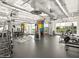 Well-equipped gym with modern machines, free weights, and colorful accents, perfect for fitness enthusiasts at 8554 W Trenton Ct, Florence, AZ 85132