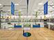 Large gym with basketball and volleyball courts with fitness equipment overlooking the space at 8554 W Trenton Ct, Florence, AZ 85132