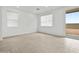 Bright living room with tile flooring and sliding glass door leading to the outside at 8554 W Trenton Ct, Florence, AZ 85132