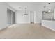 Spacious living area with tile flooring, modern light fixtures, and sliding glass doors at 8554 W Trenton Ct, Florence, AZ 85132