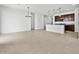 Bright and spacious living room with tile flooring adjacent to an open kitchen concept at 8554 W Trenton Ct, Florence, AZ 85132