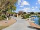 Scenic walking path featuring a charming bridge over the lake in a picturesque setting at 8554 W Trenton Ct, Florence, AZ 85132