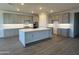 Spacious kitchen featuring an island, gray cabinets, stainless steel appliances, and modern countertops at 8561 N 175Th Ln, Waddell, AZ 85355