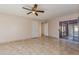 Spacious bedroom featuring tile flooring, ceiling fan, and sliding glass doors at 8626 N 50Th Ln, Glendale, AZ 85302