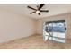 Inviting bedroom featuring tile floors, ceiling fan and large sliding glass doors at 8626 N 50Th Ln, Glendale, AZ 85302