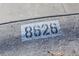 House number '8626' stenciled on the curb at 8626 N 50Th Ln, Glendale, AZ 85302