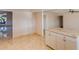 Bright kitchen area featuring tile flooring, granite counters and white cabinetry at 8626 N 50Th Ln, Glendale, AZ 85302