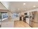 Updated kitchen showcasing stainless steel appliances, granite counters, and ample cabinet space at 8626 N 50Th Ln, Glendale, AZ 85302