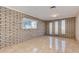 Spacious living room with unique brick wall and plenty of natural light at 8626 N 50Th Ln, Glendale, AZ 85302