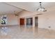 Open-concept living room boasts tile floors, recessed lighting, and a ceiling fan at 8626 N 50Th Ln, Glendale, AZ 85302