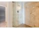 Tiled walk-in shower with a glass door and modern fixtures at 8626 N 50Th Ln, Glendale, AZ 85302