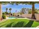 Stunning backyard features lush landscaping, sparkling pool, mature trees, and privacy at 8657 E Aster Dr, Scottsdale, AZ 85260