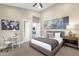 Bedroom with neutral color palette featuring ceiling fan, carpet, and walk in closet at 8657 E Aster Dr, Scottsdale, AZ 85260