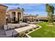 Beautiful home entrance featuring manicured landscaping and tiled walkway at 8657 E Aster Dr, Scottsdale, AZ 85260