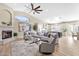 Open-concept living space showcasing a fireplace and seamless flow to the modern kitchen at 8657 E Aster Dr, Scottsdale, AZ 85260