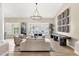 Bright living room with neutral tones and a decorative chandelier at 8657 E Aster Dr, Scottsdale, AZ 85260