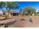 Expansive backyard featuring low maintenance desert landscaping and mature shade trees at 9360 E Milagro Ave, Mesa, AZ 85209