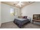 Comfortable bedroom featuring neutral walls, a large window, and carpet flooring at 9360 E Milagro Ave, Mesa, AZ 85209